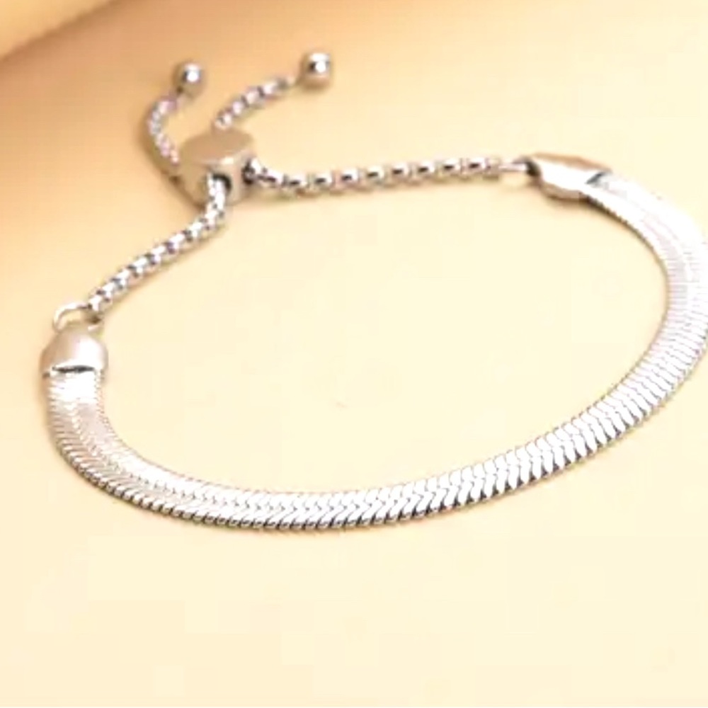 Ladies herringbone bracelet in stainless steel with adjustable ball. New